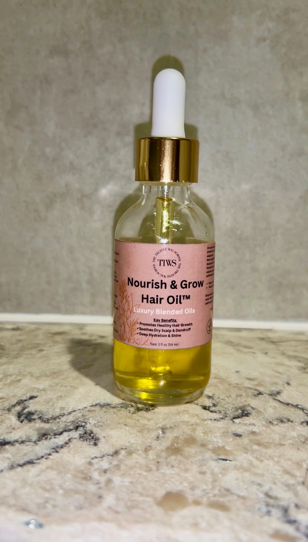 "Castor oil-infused natural hair growth oil for dry scalp treatment and hair thickening."